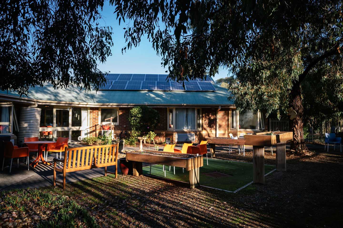 A retirement home with solar panels on the roof.