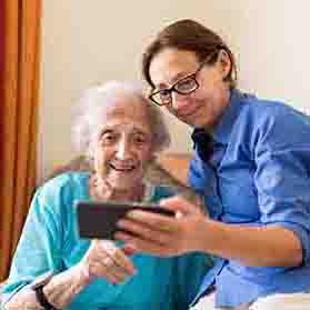 Senior woman with female caregiver