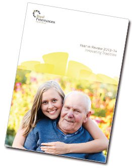Brochure cover featuring a smiling young woman hugging an older man with a background of flowers and the text "your in review 2013-14: encouraging transition.