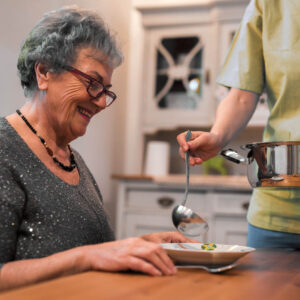 Nurse helping senior women at home